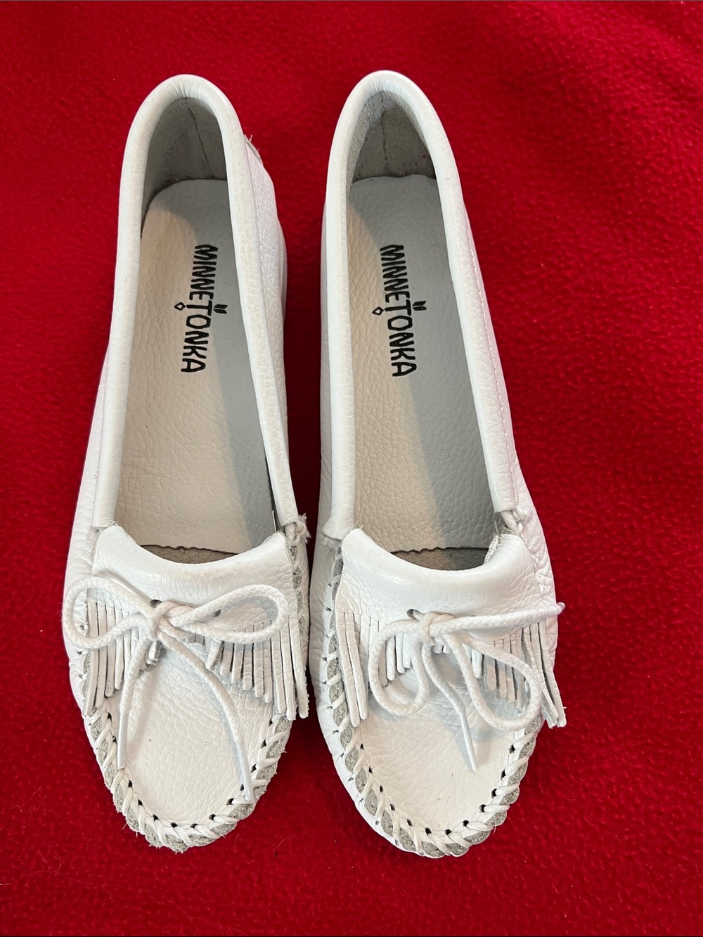 Minnetonka White Leather Fringe Moccasins with Bow Detail